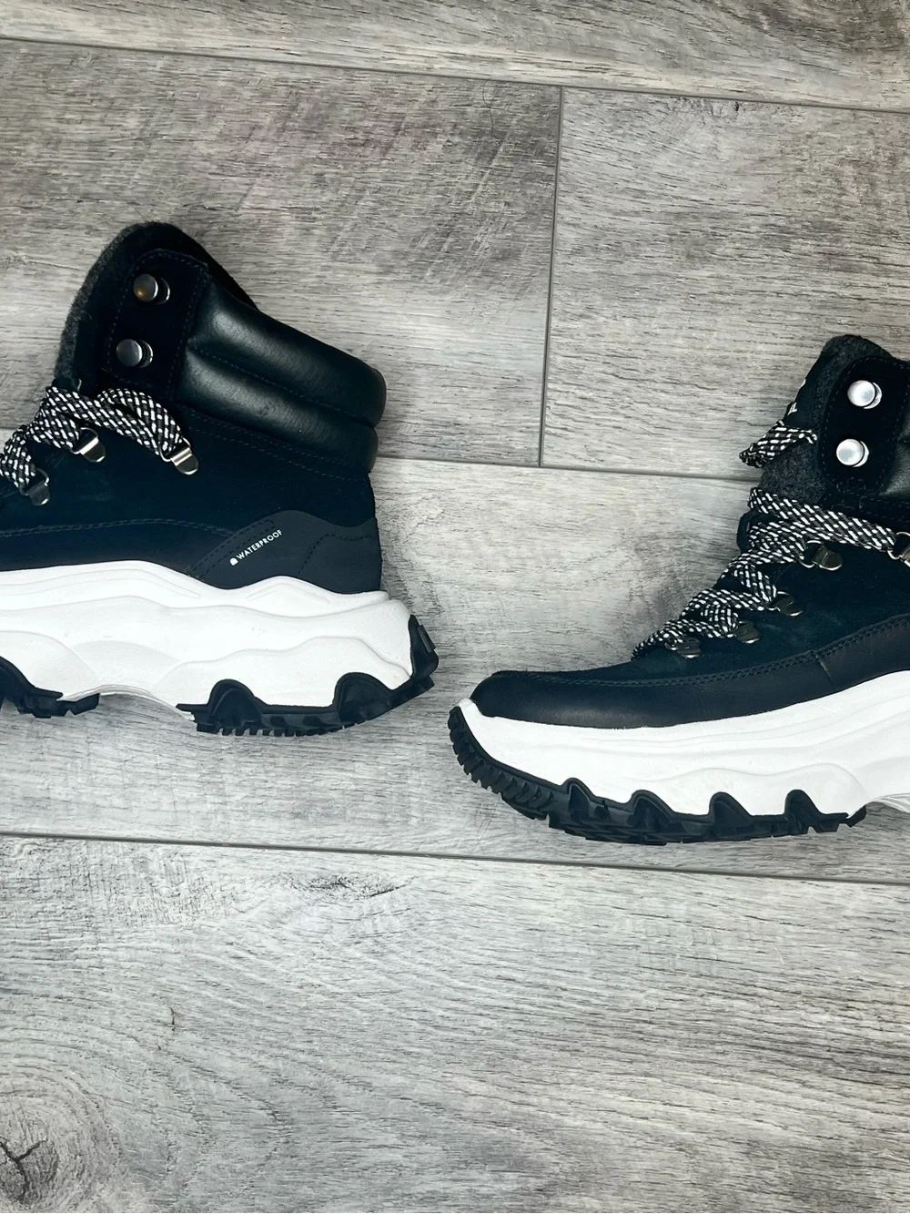 Sorel Black Lace-Up Winter Boots with White Accents